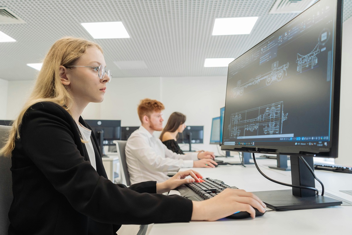 students using computers in class